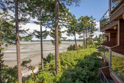 a view of the river from a balcony of a house at Tigh-Na-Mara Seaside Spa Resort in Parksville