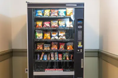 a vending machine filled with lots of soda and snacks at Days Inn by Wyndham Bonnyville in Bonnyville