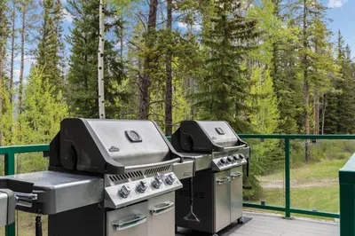 two grills and a grill on a deck at WorldMark Canmore-Banff in Canmore