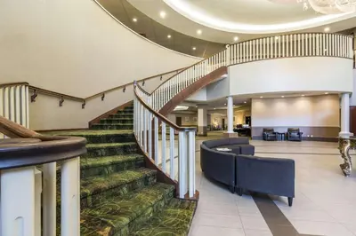 a spiral staircase in a hospital with a lobby at Clarion Hotel & Conference Centre in Sherwood Park
