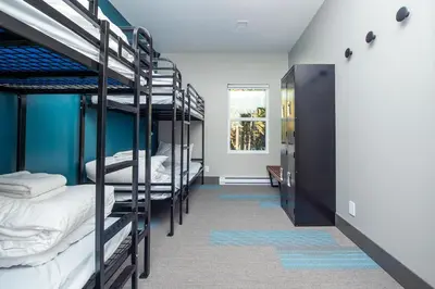 a dorm room with bunk beds in it at Nowhere Special Hostel in Rossland