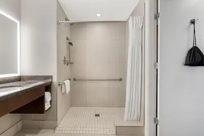 a bathroom with a shower and a sink at Best Western Plus Revelstoke in Revelstoke