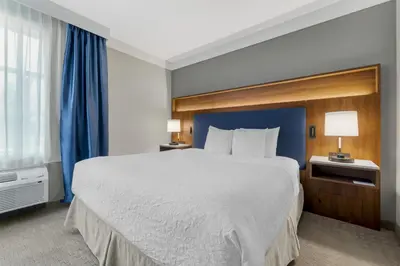 a hotel room with a large bed and a window at Best Western Plus Revelstoke in Revelstoke