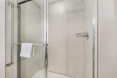 a shower with a glass door in a bathroom at Best Western Plus Revelstoke in Revelstoke