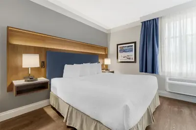 a hotel room with a large bed and a window at Best Western Plus Revelstoke in Revelstoke