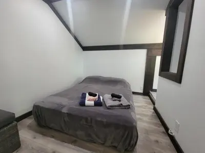 a small bed in a room with a ceiling at Noah's Ark Campground in Revelstoke