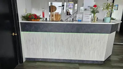 a counter in a store with flowers on it at Port-O-Call Inn in Nanaimo