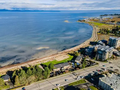 an aerial view of a beach and the ocean at Sea Edge Beachside Hotel in Parksville