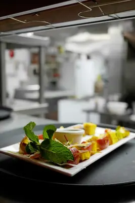 a plate of food on a table in a kitchen at Fernie Stanford Resort in Fernie