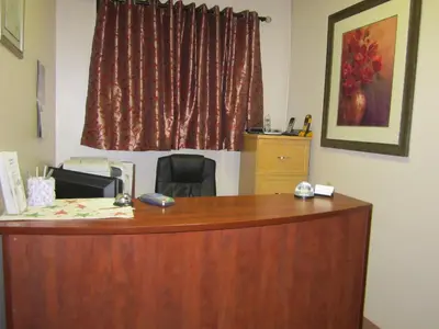 an office with a wooden desk and a window at Viking Lamplighter Motel in Viking