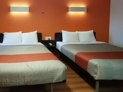 a hotel room with two beds in a room at Motel 6-Cranbrook, BC in Cranbrook
