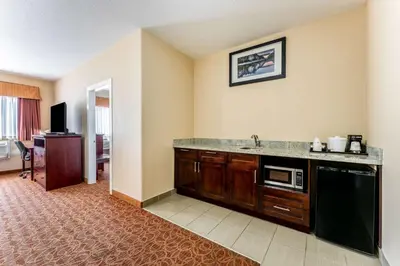 a kitchen with a sink and a microwave at Best Western Williams Lake in Williams Lake