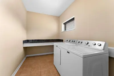 a laundry room with a white washer and dryer at Best Western Williams Lake in Williams Lake