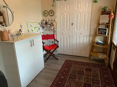 a kitchen with a white refrigerator and a door at Orchid House near Vancouver YVR Airport in Richmond