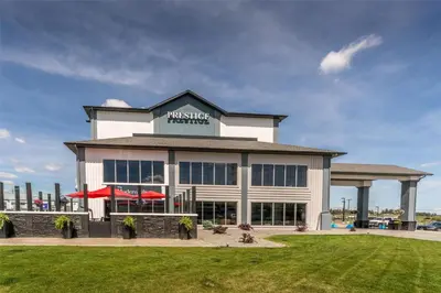 a large white building with a sign on it at Prestige Cranbrook Hotel, BW Premier Collection in Cranbrook