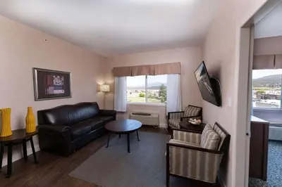 a living room with a couch and a table at Prestige Cranbrook Hotel, BW Premier Collection in Cranbrook