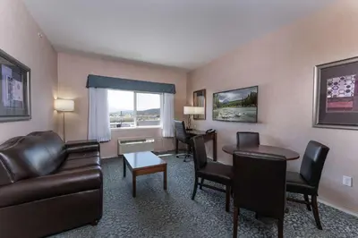 a living room with a couch and a table at Prestige Cranbrook Hotel, BW Premier Collection in Cranbrook