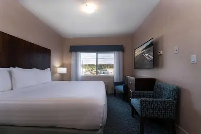 a hotel room with a bed and a window at Prestige Cranbrook Hotel, BW Premier Collection in Cranbrook