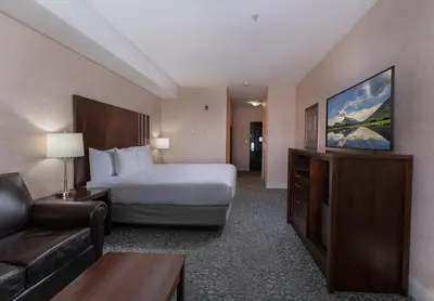a hotel room with a bed and a couch at Prestige Cranbrook Hotel, BW Premier Collection in Cranbrook