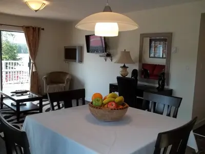 a bowl of fruit on a table in a living room at Bayshore Waterfront Inn in Ucluelet