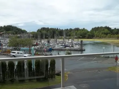 a view of a marina with boats in the water at Bayshore Waterfront Inn in Ucluelet