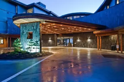 an empty parking lot in front of a building at Black Rock Oceanfront Resort in Ucluelet