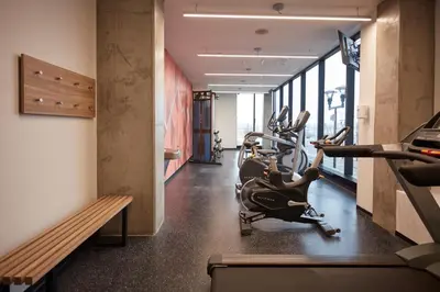 a gym with treadmills and ellipticals in a building at Alt Hotel Calgary East Village in Calgary