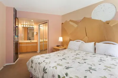 a bedroom with a large bed and a bathroom at The Marquise by Whistler Premier in Whistler