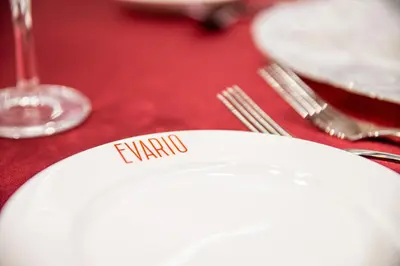 a white plate with the word karma on it on a table at Holiday Inn Edmonton South - Evario Events by IHG in Edmonton