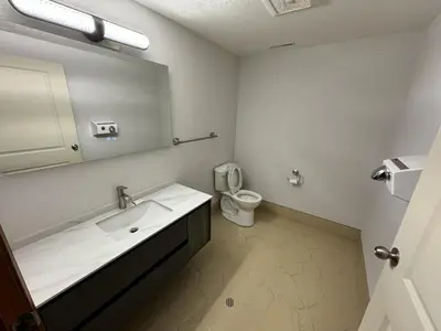 a bathroom with a sink and a toilet at Inntowne Motel in Hope