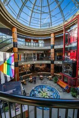 an overhead view of a library with a glass ceiling at Coast Lonsdale Quay Hotel in North Vancouver