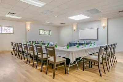 a conference room with a long table and chairs at Bayside Resort, an Ascend Collection Resort in Parksville