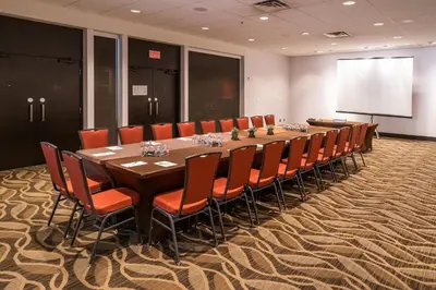 a large conference room with a long table and chairs at Holiday Inn & Suites Vancouver Downtown by IHG in Vancouver