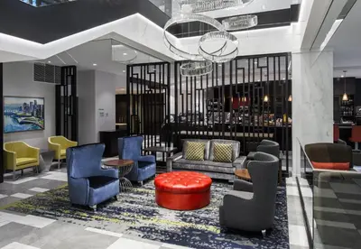 a lobby with colorful chairs and a bar at Holiday Inn & Suites Vancouver Downtown by IHG in Vancouver