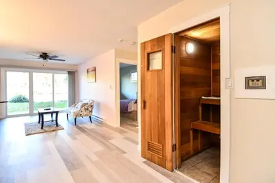 a room with a door leading to a bedroom at Chateau Riverside in Campbell River