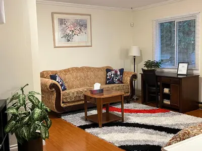 a living room with a couch and a table at Vancouver shaughnessy guest home in Vancouver