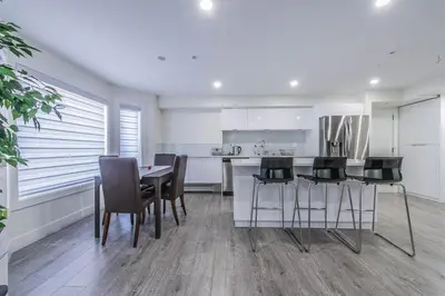 a kitchen with a table and chairs in a room at Private Vacation Guest Suite Near Beach in White Rock