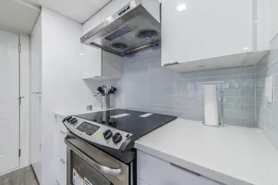 a kitchen with a sink and a stove at Private Vacation Guest Suite Near Beach in White Rock