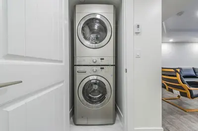 a kitchen with a washer and dryer in a room at Private Vacation Guest Suite Near Beach in White Rock
