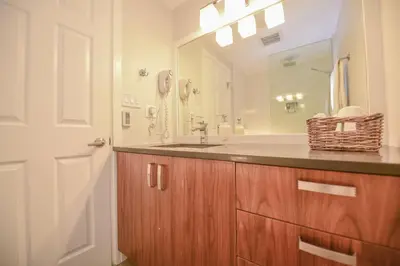 a bathroom with a sink and a mirror at Newly Renovated Whistler Studio in Whistler
