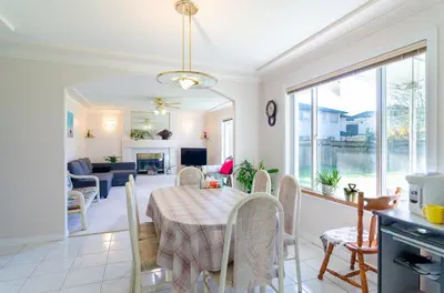 a kitchen and dining room with a table and chairs at Great Guest Suite in a Gorgeous House in New Westminster