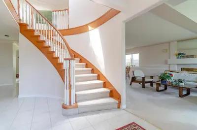 a winding staircase in a home with a living room at Great Guest Suite in a Gorgeous House in New Westminster