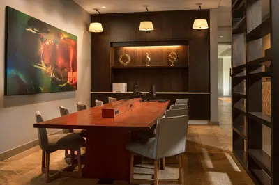 a conference room with a large wooden table and chairs at Hyatt Place Calgary Airport in Calgary