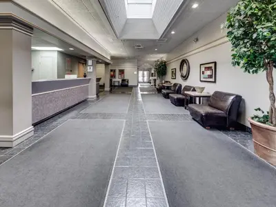 a lobby with leather chairs and a waiting room at Heritage Inn Hotel & Convention Centre - Cranbrook in Cranbrook
