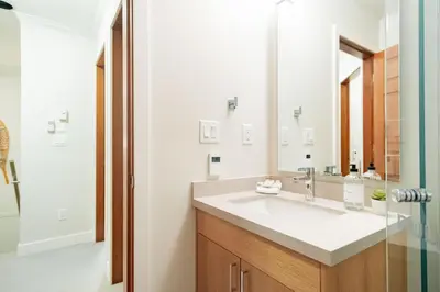 a bathroom with a sink and a mirror at Sunpath by Outpost Whistler in Whistler