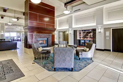 a lobby of a hotel with a fireplace at Hampton Inn & Suites by Hilton Calgary-Airport in Calgary