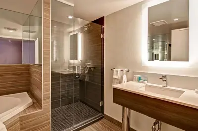 a bathroom with a sink and a shower at Hampton Inn & Suites by Hilton Calgary-Airport in Calgary