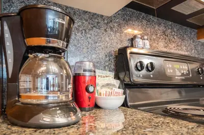 a blender sitting on top of a kitchen counter at Glaciers Lodge by Outpost Whistler in Whistler