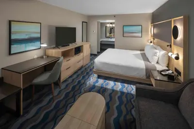 a hotel room with a bed and a desk at Accent Inns Victoria in Victoria