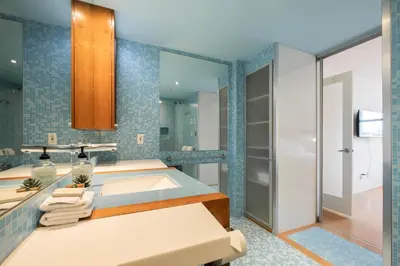 a bathroom with a sink and a shower at Woodrun by Outpost Whistler in Whistler